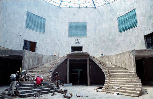 Workers installing imported marble on a staircase at Mr. Alamieyeseigha's official mansion.