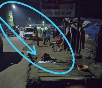 Girl Seen Reading Beside The Gutter With Street Light (PHOTO)