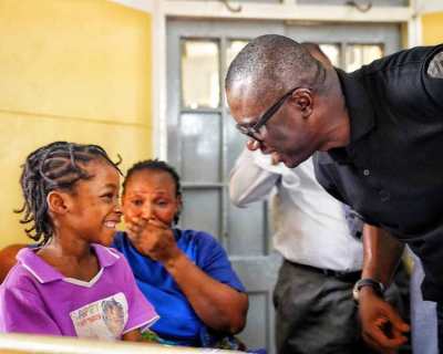 Lagos Building Collapse: Babajide Sanwo-Olu All Smiles With A Girl Who Survived (PHOTO)