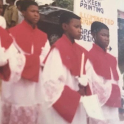 "My Mother Wanted Me To Be A Reverend Father" - John Dumelo Shares Throwback Photo