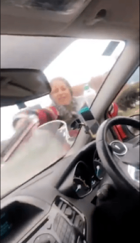 Nigerians Surprised As They See Female Traffic Windscreen Cleaners Abroad
