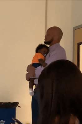 Professor Helps Student To Calm Crying Baby During Lecture As He Continue Teaching