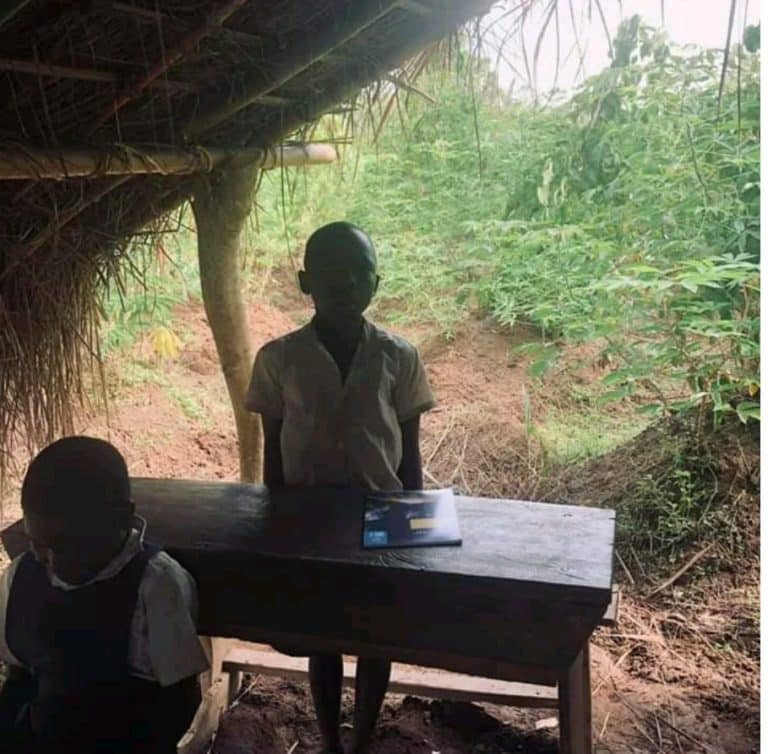 Primary school where students learn under thatch hut