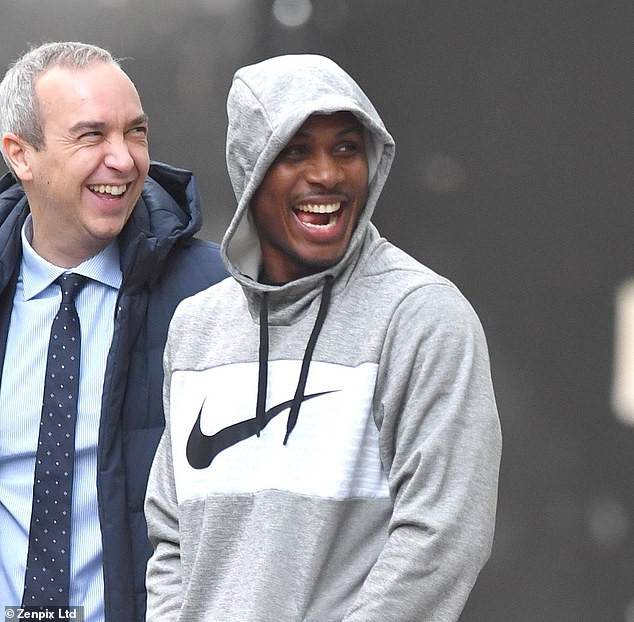 Odion Ighalo leaves his Manchester hotel all smile