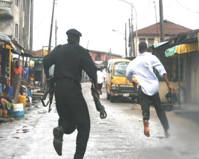 Police in Nigeria chasing a suspect