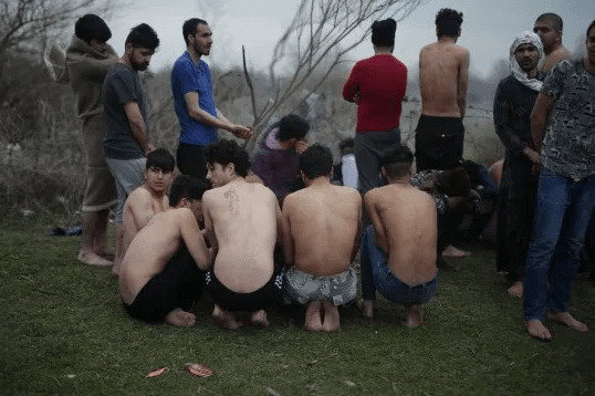 Refugees attempting to enter Greece are stripped to their underwear and forced back to Turkey (photos)