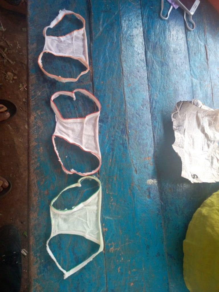 Residents of Kenyan community reduced to wearing panties fashioned into facemasks after they were duped by unscrupulous traders (photos)