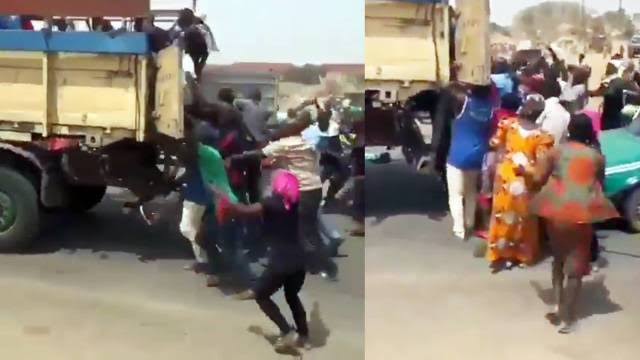 Abuja residents stealing rice from a truck