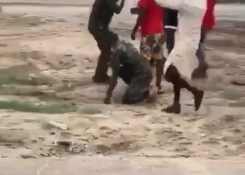 Soldier getting the beating of his life in Warri