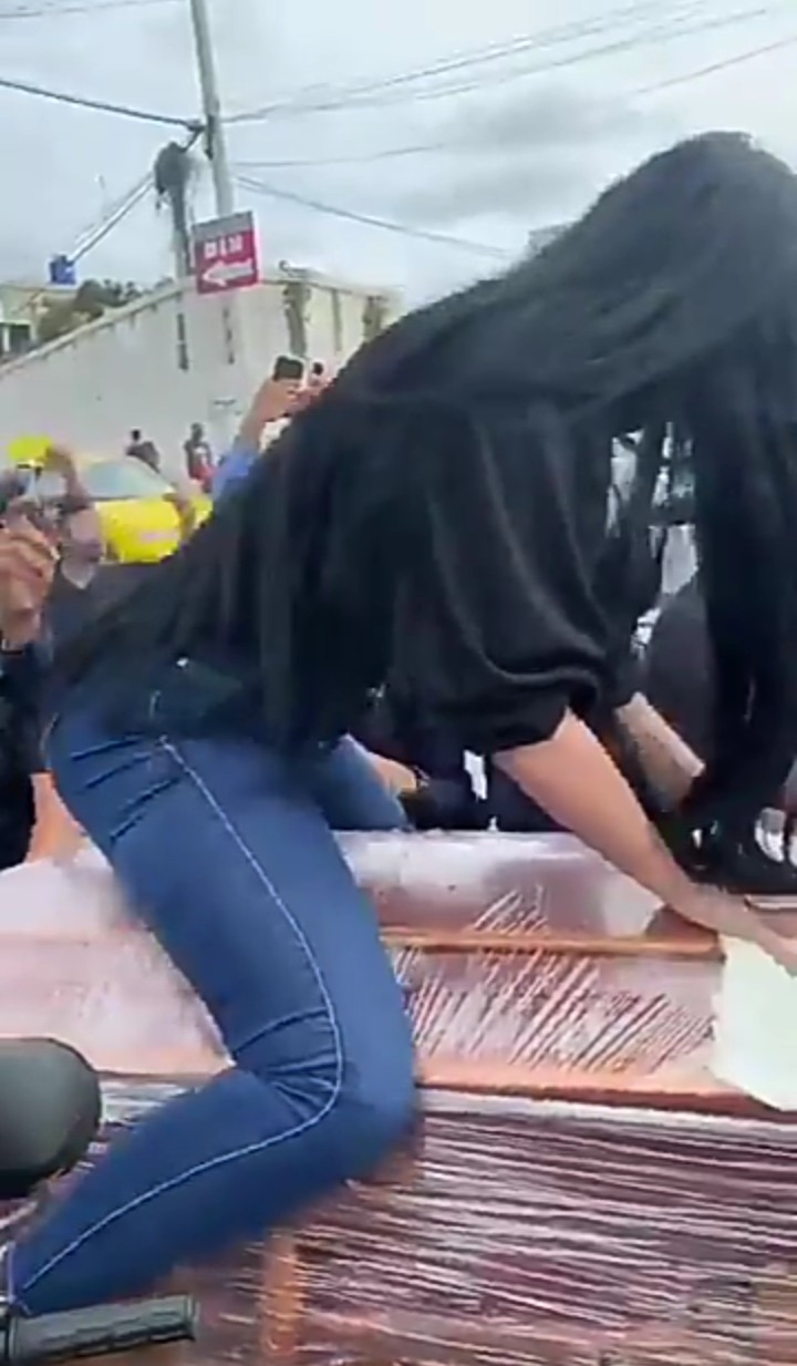 Woman twerks on top of half-opened coffin as funeral takes strange turn (video)