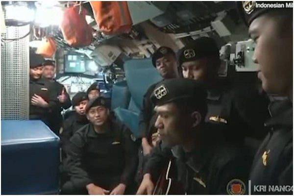 Indonesia submarine crew members singing before their submarine sank