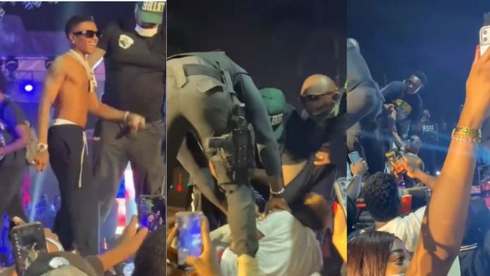 Wizkid Falls On Stage As Fans Drag His Leg During Abuja Concert [Video]