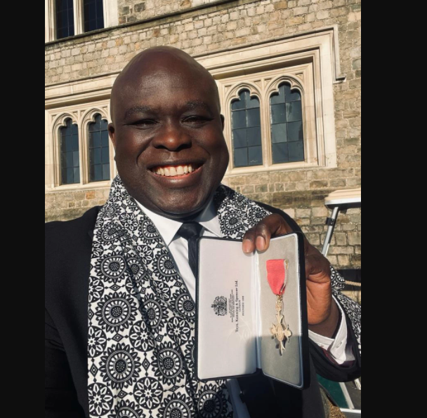 Gospel singer, Muyiwa Olarewaju receives an OBE medal from Prince William (photos)