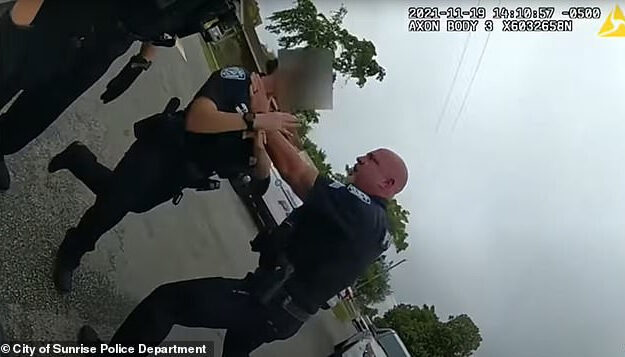 Policeman Grabs Female Colleague By The Throat, Shoves Her Into Patrol Car After She Pulled Him Off Suspect (Video)