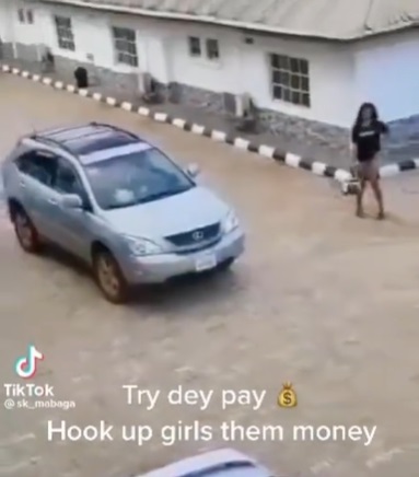 Hookup: Lady Races After Client’s Car To Stop Him From Leaving After He Refused To Pay Her (Video)