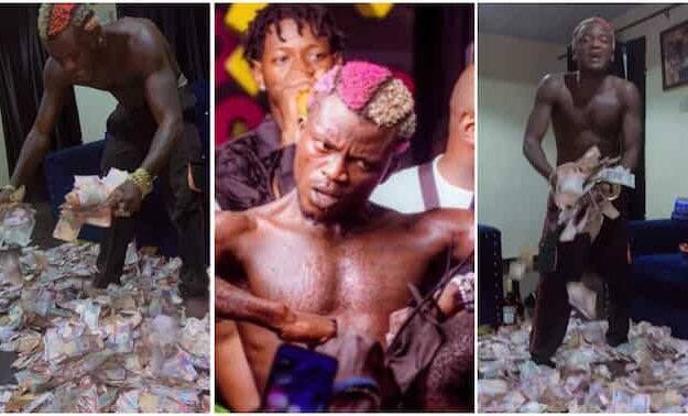 Portable Shows Off Wads Of Naira Notes His Fans Sprayed On Him During Show [Video]