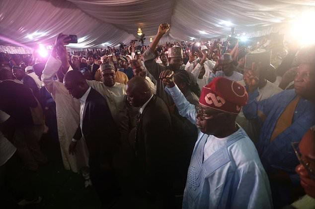 Nigerian ruling party candidate Bola Tinubu acknowledges supporters in Abuja on March 1, 2023 during celebrations on his election win in Abuja