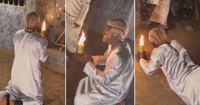 Portable Rolls On Floor With Candle As He Prays To God To Make Him A Billionaire [Video]