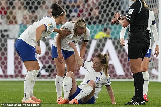 England's Keira Walsh center sits on the pitch after an injury during the Women's World Cup Group D soccer match between England and Denmark at the Sydney Football Stadium in Sydney, Australia, Friday, July 28, 2023. (AP Photo/Mark Baker)